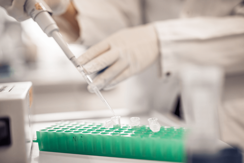 Pipette in lab and eb researcher's hands