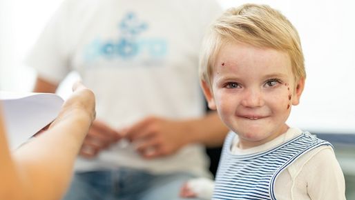 EB Patient smiles at camera