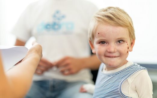 EB Patient smiles at camera